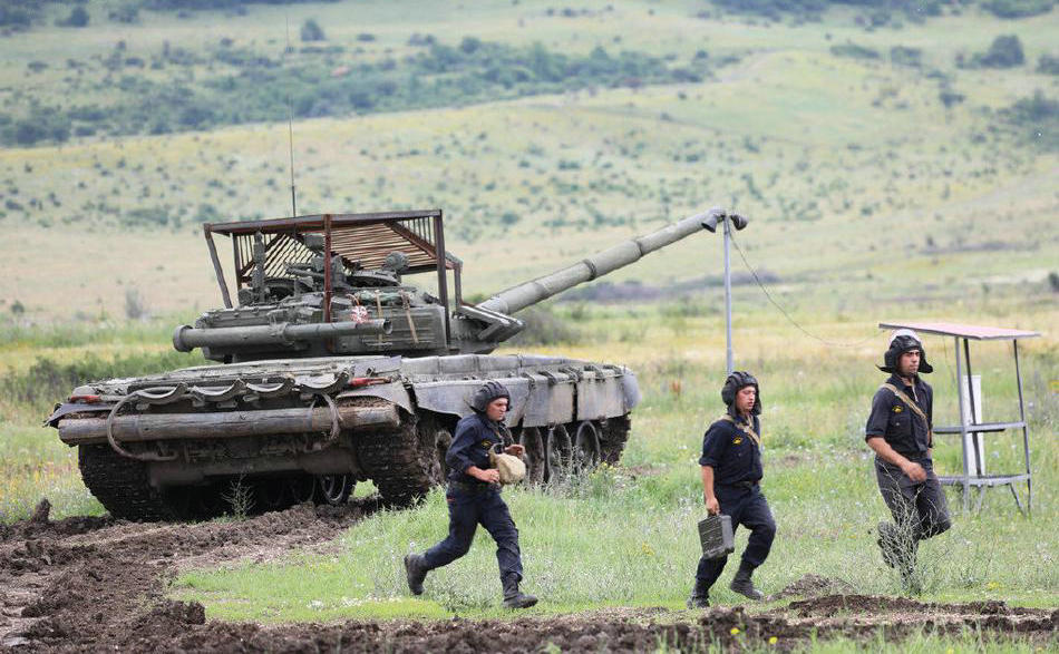 Welded iron cages on top of Russian tanks defend against Ukrainian