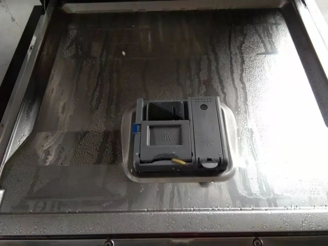 What should I do if the dishes have water stains after washing in the