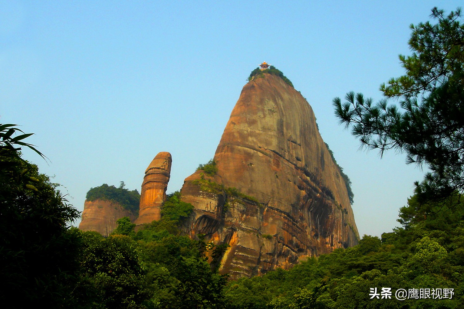 Wind-swept Danxia cliffs with dramatic sky